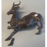 Chinese patinated bronze study of a deer or stag with relief and incised scroll decoration. 32 cm