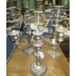 Five heavy white metal candelabra with various relief decoration, one silver plate on copper, Art