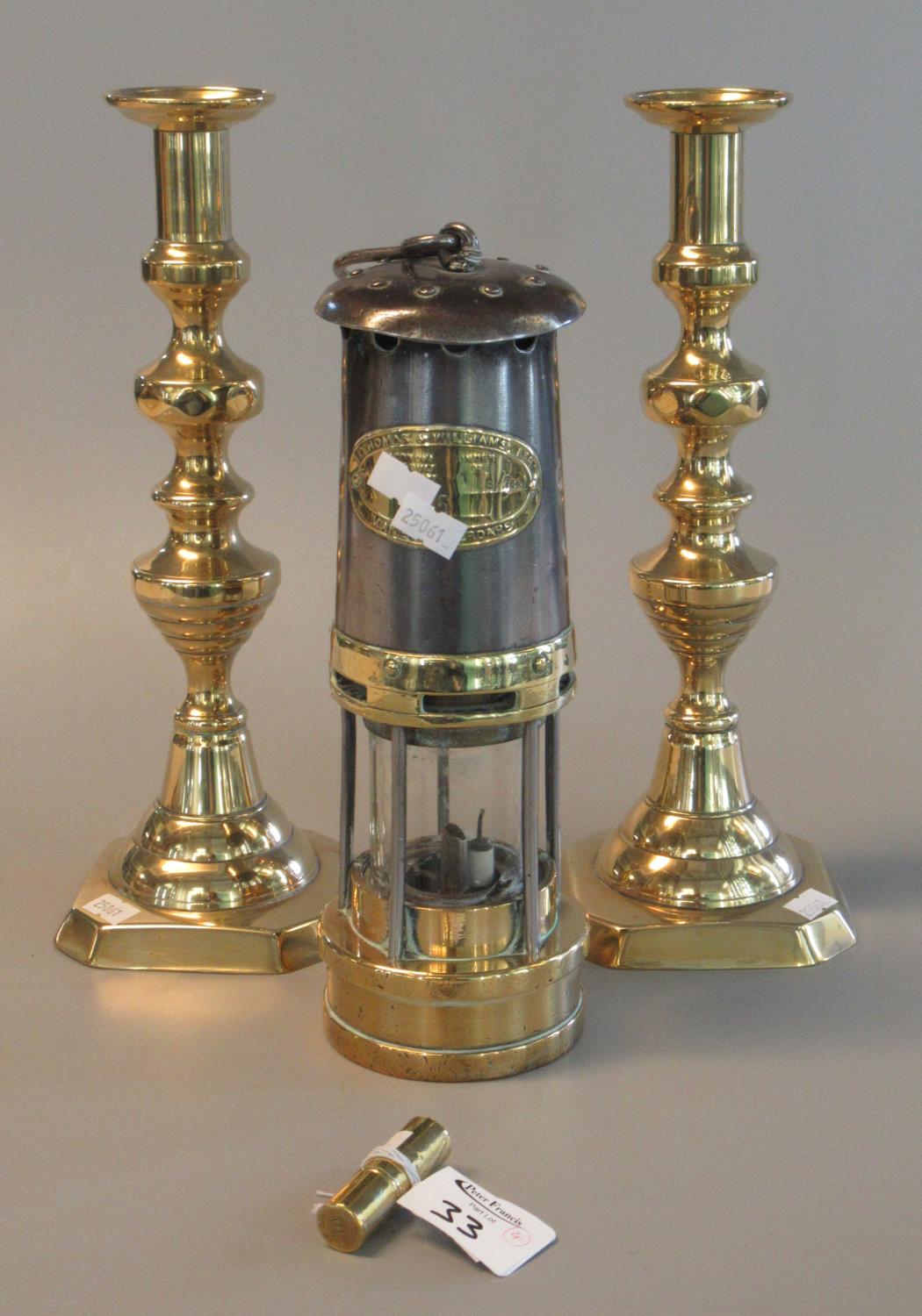 Pair of brass baluster candlesticks, 32 cm high approx. Together with a small cylindrical brass