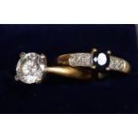 9ct gold sapphire and diamond ring and a 9ct gold cz solitaire ring. Both ring size O. Approx weight