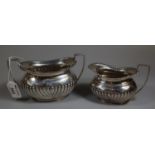 Mappin & Webb silver and fluted single handled cream jug with matching two handled boat shaped