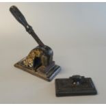 Heavy gilded metal letter embosser, together with a cast iron rectangular design paper weight with