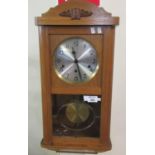 Mid century German three-train oak cased wall clock with key and pendulum. (B.P. 21% + VAT)