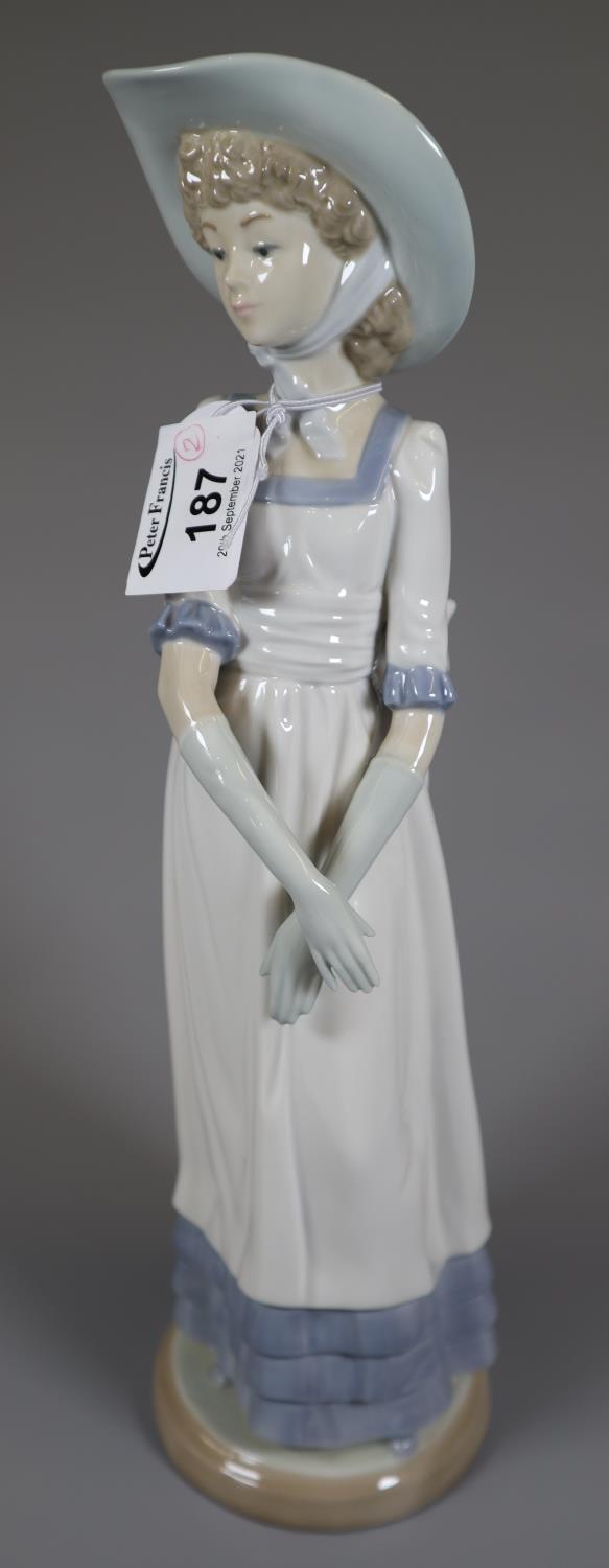 Nao Spanish porcelain figurine of a young lady with hat and dress with bow, together with - Image 3 of 3
