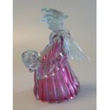 Novelty cranberry and clear art class candle holder in the form of an angel. (B.P. 21% + VAT)