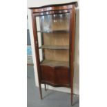 Edwardian mahogany inlaid serpentine front, glazed display cabinet with shaped shelves. (B.P. 21 +