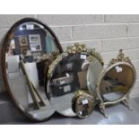 Collection of mirrors to include swivel table mirror, frameless bevel mirror with floral mounts,