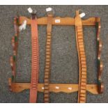 Wooden wall hanging gun rack with cartridge belts. (B.P. 21% + VAT)