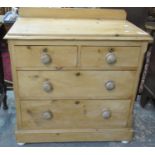 Victorian pine straight front chest with two short and two long drawers, on projecting base and