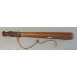 Turned hardwood truncheon with cord wrist loop. 40.5 cm approx. (B.P. 21% + VAT)