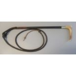 Leather covered hunting crop with white metal band and simulated horn handle, with braided leather