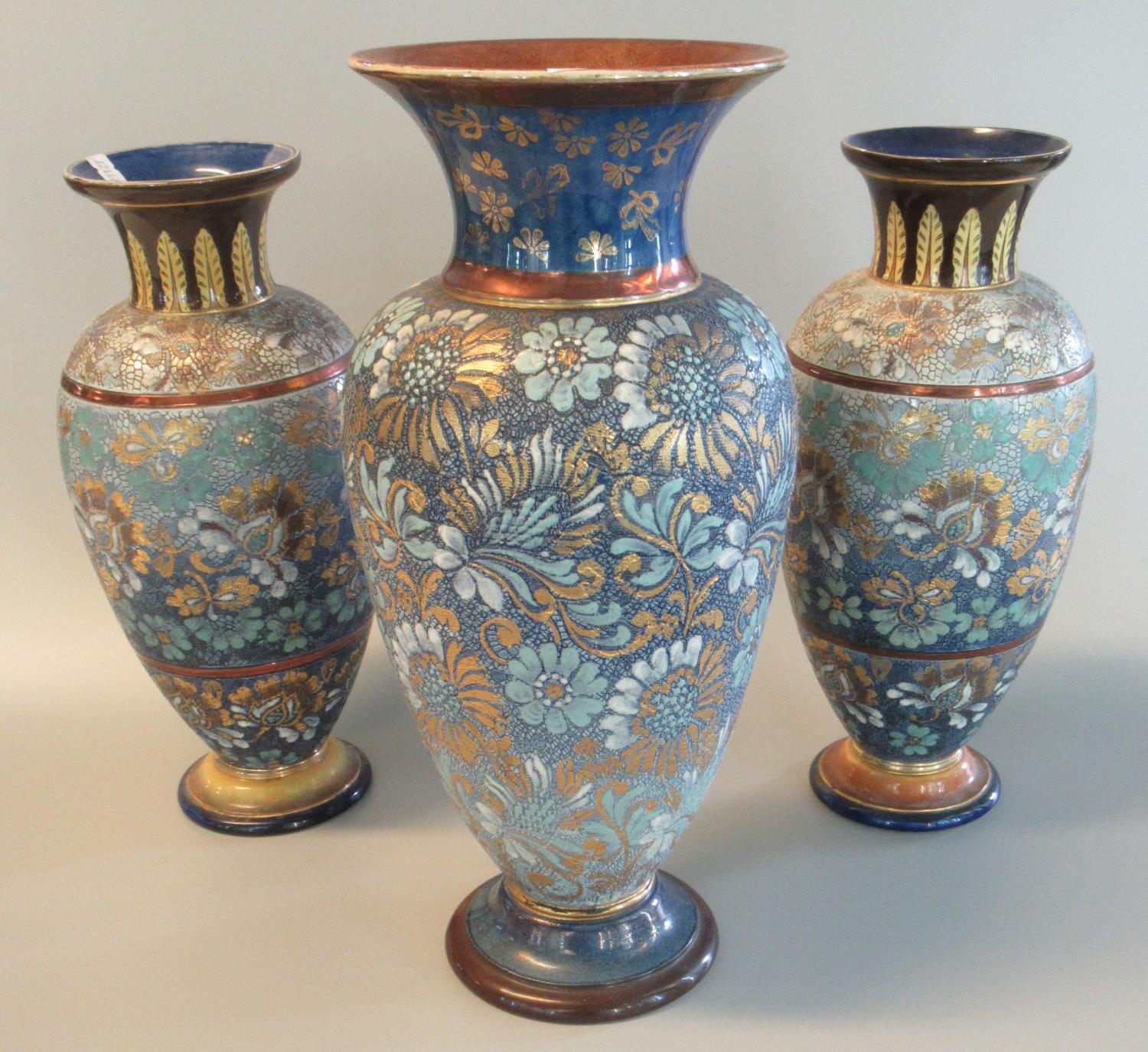 Pair of Doulton Lambeth stoneware baluster vases, hand painted with flowers and foliage together