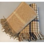Cream ground and multicoloured check blanket, together with another brown ground blanket. (B.P.