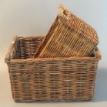 Two wicker rectangular shaped fruit baskets with wooden carrying handles. (B.P. 21% + VAT)