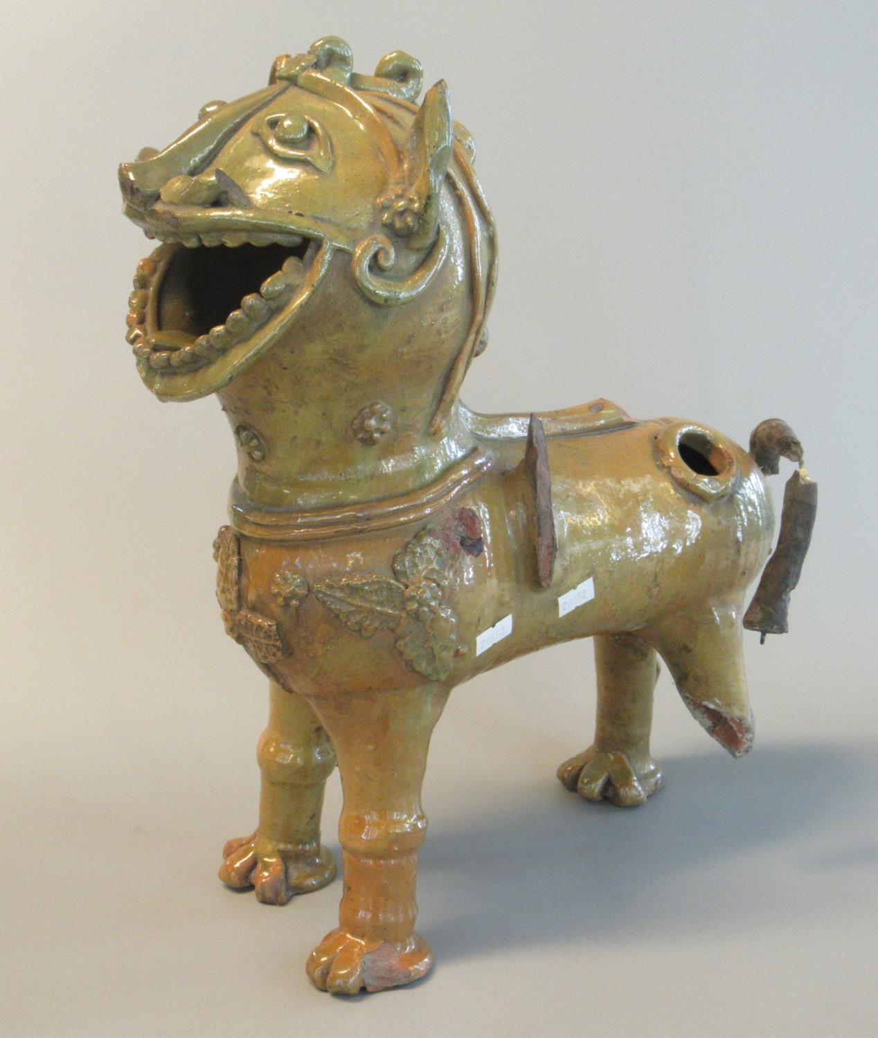 Unusual Oriental style glazed pottery temple lion, possibly designed as a pouring vessel with