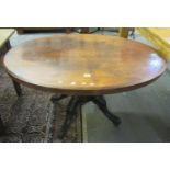 19th century walnut inlaid loo(???) table on carved quatroform base and casters. (B.P. 21% + VAT)