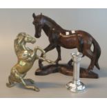 Carved hardwood study of a horse, 20 cm long approx. Together with a very heavy cast brass horse, 21