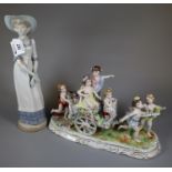 Nao Spanish porcelain figurine of a young lady with hat and dress with bow, together with