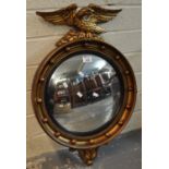 Regency style gilt framed convex mirror with eagle pediment. 20th century. (B.P. 21 + VAT)