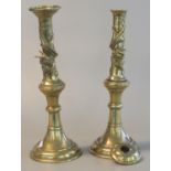 Pair of heavy yellow metal oriental baluster shaped candlesticks decorated with entwined dragons. 35