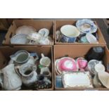 Four boxes of assorted china to include: blue and white Delft style planter, pedestal cake stand,