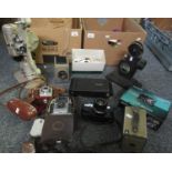Two boxes of assorted photographic equipment to include: G. B. Bell & Howell 8mm projector model