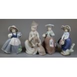 Two Lladro Spanish porcelain figurines, one in matt finish of a young girl with puppy, the other a