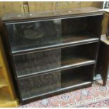 Mid century mahogany three-section sectional bookcase with glass sliding doors. (B.P. 21 + VAT)
