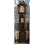 Reproduction Westminster Germany mahogany finish long case clock with pendulum and three weights. (