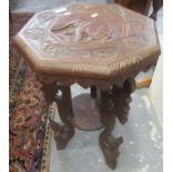 Carved hardwood probably Indian octagonal lamp table with under tier and elephant decoration. (B.