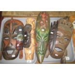 Two trays of wooden tribal masks. (Seven items in total.) (B.P. 21% + VAT)