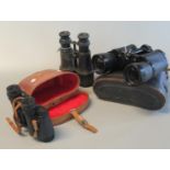 Pair of Regent 7x50 binoculars in leather case, pair of Seeker S.T.C 8x30 binoculars in pig skin