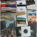 Box of Beatles and related artists LPs and singles. Singles include: 'From Me to You', 'Twist and