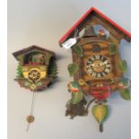 Two small 20th century Swiss cuckoo clocks. (2) (B.P. 21% + VAT)