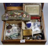 Oak box containing assorted military interest items to include solid silver frame with military