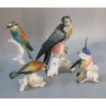 Three Karl Ens porcelain figures of birds to include two bee eaters perched on a branch, impressed