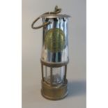 Protector Lamp & Lighting co. Ltd. of Eccles type 6 brass miners safety lamp, appearing unused. (B.