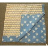 Vintage cotton quilt, one side with tree pattern on blue background, the other with geometric
