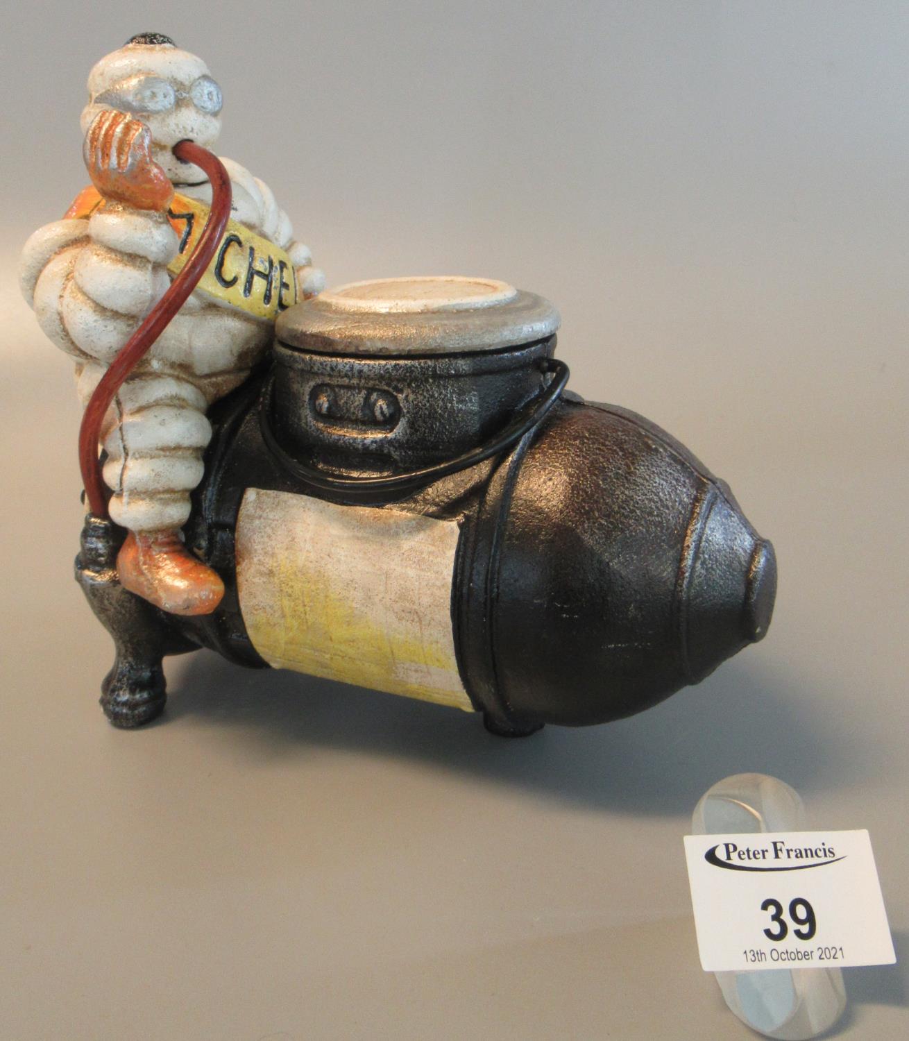 Modern cast metal Michelin man ornament. (B.P. 21% + VAT)