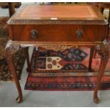 Reproduction mahogany writing desk with leather insert top above single pull-out drawer on