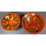 Two Poole pottery orange ground stylised floral and foliate bowls. (2) (B.P. 21% + VAT)