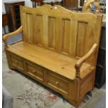 Modern pine high back settle with shaped back and shaped open arms and hinged lid with three dummy