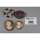 Two 9ct gold shell cameo brooches, an agate specimen brooch and a costume brooch.(B.P. 21% + VAT)