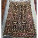 Three Middle Eastern design carpets on orange, red and blue grounds with floral and geometric