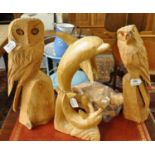 Three naively carved wooden sculptures of dolphins, an owl and a bird of prey. (B.P. 21% + VAT)