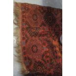 Distressed Middle Eastern design brown and orange ground geometric floral and foliate carpet. (B.