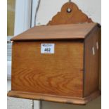 Pine slope front candle box with hinged lid and shaped handle. (B.P. 21% + VAT)