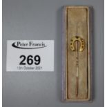 9ct gold horseshoe stick pin.(B.P. 21% + VAT)