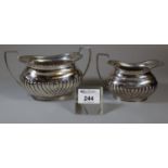 Mappin & Webb silver and fluted single handled cream jug with matching two handled boat shaped