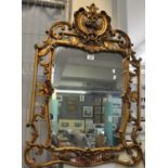 19th century style gilt framed pierced mirror decorated with flowers, foliage and berries. (B.P. 21%